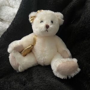 White bear with gold bow and bag. 6in
